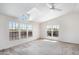 A bright bedroom featuring plush carpet, ceiling fan and a skylight at 49039 N 24Th Ave, New River, AZ 85087