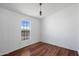 Bedroom featuring new flooring, natural light, and a clean and simple aesthetic at 49039 N 24Th Ave, New River, AZ 85087
