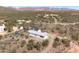 Exterior of home in a desert setting featuring solar panels for energy efficiency at 49039 N 24Th Ave, New River, AZ 85087