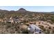 Exterior shot of desert home with mountain backdrop, plus outbuildings and space at 49039 N 24Th Ave, New River, AZ 85087