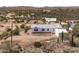 Exterior of desert home with view of mountains, community and natural desert scape at 49039 N 24Th Ave, New River, AZ 85087