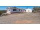 This charming desert home features an exterior and convenient shed at 49039 N 24Th Ave, New River, AZ 85087