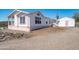 This charming desert home features an exterior and convenient shed at 49039 N 24Th Ave, New River, AZ 85087