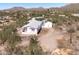 This charming desert home features an exterior and convenient shed at 49039 N 24Th Ave, New River, AZ 85087