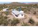 Aerial home in desert area with solar panels for energy efficiency, and native plants at 49039 N 24Th Ave, New River, AZ 85087
