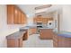 Well-lit kitchen features custom cabinetry, an island with seating, and modern appliances at 49039 N 24Th Ave, New River, AZ 85087