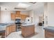Well-appointed kitchen featuring a functional island, stainless steel appliances, and ample cabinet space at 49039 N 24Th Ave, New River, AZ 85087