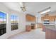 Open-concept kitchen with breakfast nook, tile floor, oak cabinets and scenic views at 49039 N 24Th Ave, New River, AZ 85087