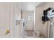Functional laundry area with a washer, dryer, and door to the outside at 49039 N 24Th Ave, New River, AZ 85087