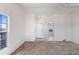 Bright living room with a view showcases a ceiling fan, multiple windows, and neutral carpeting at 49039 N 24Th Ave, New River, AZ 85087