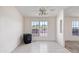 Cozy living space featuring tile floors, a wood-burning stove, and well-lit with dual pane windows at 49039 N 24Th Ave, New River, AZ 85087