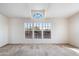 A bright living room featuring plush carpet, and a skylight at 49039 N 24Th Ave, New River, AZ 85087