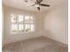 Neutral bedroom features a ceiling fan and plantation shutters for bright, natural light at 4940 S Rosemary Dr, Chandler, AZ 85248
