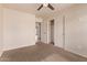 Bedroom with neutral color scheme and closet doors leading to other rooms in the home at 4940 S Rosemary Dr, Chandler, AZ 85248