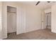 Bedroom featuring carpeted floors and closet and doorway access in neutral color scheme at 4940 S Rosemary Dr, Chandler, AZ 85248