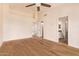 Spacious bedroom featuring hardwood floors, a ceiling fan and two closets at 4940 S Rosemary Dr, Chandler, AZ 85248
