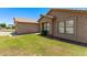 Well-maintained exterior with manicured lawn, mature bushes, and a neutral color palette at 4940 S Rosemary Dr, Chandler, AZ 85248