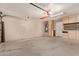 Spacious garage with cabinets providing ample storage space, as well as epoxy flooring at 4940 S Rosemary Dr, Chandler, AZ 85248