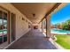Covered patio overlooking a pool, hot tub, and lush landscaping for ultimate relaxation at 4940 S Rosemary Dr, Chandler, AZ 85248