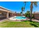 Beautiful backyard pool with mature landscaping, basketball hoop, and large covered patio at 4940 S Rosemary Dr, Chandler, AZ 85248