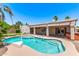 Backyard pool with basketball hoop, hot tub, desert landscaping, and spacious covered patio at 4940 S Rosemary Dr, Chandler, AZ 85248