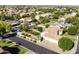 This aerial view shows a home with a private pool and extensive backyard surrounded by mature trees and landscaping at 541 E Spur Ave, Gilbert, AZ 85296