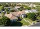 An aerial view of the home showcases the well-manicured front lawn and architectural details of the house at 541 E Spur Ave, Gilbert, AZ 85296