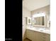 Bathroom with vanity, marble countertop, framed mirror, updated fixtures and overhead lighting at 541 E Spur Ave, Gilbert, AZ 85296