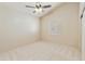 Well-lit bedroom with neutral carpet, ceiling fan and window with plantation shutters at 541 E Spur Ave, Gilbert, AZ 85296