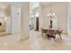 Open-concept dining room with tile flooring, a stylish chandelier, and a view into the home's living areas at 541 E Spur Ave, Gilbert, AZ 85296