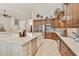 Modern kitchen with stainless steel appliances, custom cabinetry, and a large island at 541 E Spur Ave, Gilbert, AZ 85296