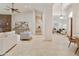 Open layout showing a fireplace in the living room, tile floors, high ceilings and neutral colors at 541 E Spur Ave, Gilbert, AZ 85296