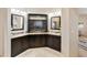 The main bathroom showcases dual sinks, dark cabinetry, and elegant granite countertops at 541 E Spur Ave, Gilbert, AZ 85296