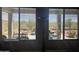 View of desert backyard through window with shaded patio and seating at 5637 E Lonesome Trl, Cave Creek, AZ 85331