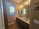 Bathroom featuring double sinks, granite countertops, and a window view at 5637 E Lonesome Trl, Cave Creek, AZ 85331