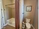 Bright bathroom featuring a shower-tub combo and neutral earthy tones at 5637 E Lonesome Trl, Cave Creek, AZ 85331
