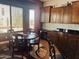 Charming breakfast nook with wood table, chairs, cabinetry, and natural lighting at 5637 E Lonesome Trl, Cave Creek, AZ 85331