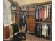 Walk-in closet with custom shelving, drawers, and hanging space for clothing at 5637 E Lonesome Trl, Cave Creek, AZ 85331