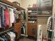 Spacious walk-in closet with custom storage solutions, including shelving, drawers, and hanging rods at 5637 E Lonesome Trl, Cave Creek, AZ 85331