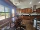 Cozy dining area with a round table, wood chairs, and adjacent kitchen at 5637 E Lonesome Trl, Cave Creek, AZ 85331