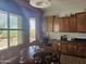 Inviting dining area with round table, chairs, and natural light from the window at 5637 E Lonesome Trl, Cave Creek, AZ 85331