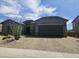 View of the house and the brick paved driveway at 5637 E Lonesome Trl, Cave Creek, AZ 85331