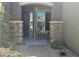Inviting covered porch with stone accents and outdoor seating at 5637 E Lonesome Trl, Cave Creek, AZ 85331