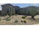 Charming home featuring desert landscaping, including cacti and drought-tolerant plants at 5637 E Lonesome Trl, Cave Creek, AZ 85331