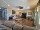 Spacious living room with comfortable seating, ceiling fan, and wood-look flooring at 5637 E Lonesome Trl, Cave Creek, AZ 85331