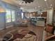 Open concept living area with kitchen view, tiled floors, and backyard views at 5637 E Lonesome Trl, Cave Creek, AZ 85331