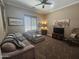 Comfortable living room with a large television, comfortable seating, and window views at 5637 E Lonesome Trl, Cave Creek, AZ 85331