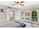 Tranquil bedroom with neutral tones, ceiling fan, and French doors leading to the outdoor patio at 5818 N 3Rd Ave, Phoenix, AZ 85013