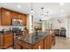 Modern kitchen featuring granite countertops, stainless steel appliances, and a large island with barstool seating at 5818 N 3Rd Ave, Phoenix, AZ 85013