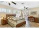 Main bedroom featuring natural light, decorative fans, and private outdoor access at 5818 N 3Rd Ave, Phoenix, AZ 85013